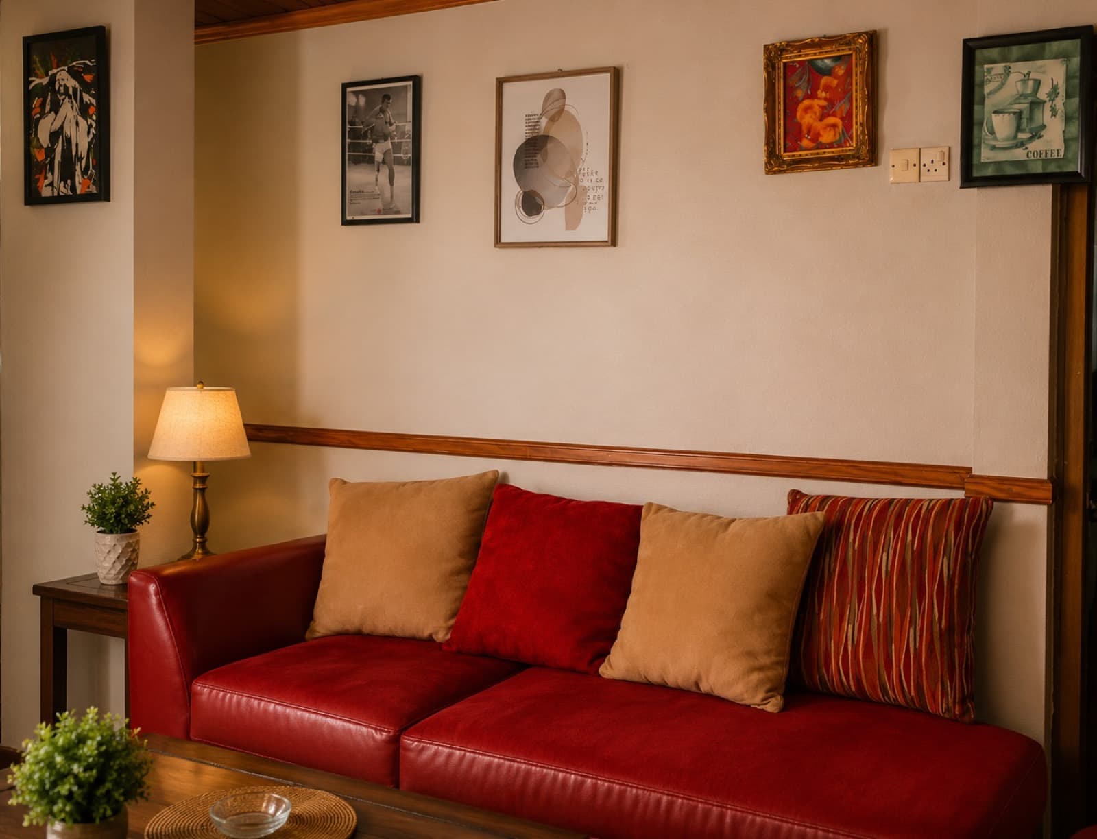 The guest lounge with a red leather sofa
