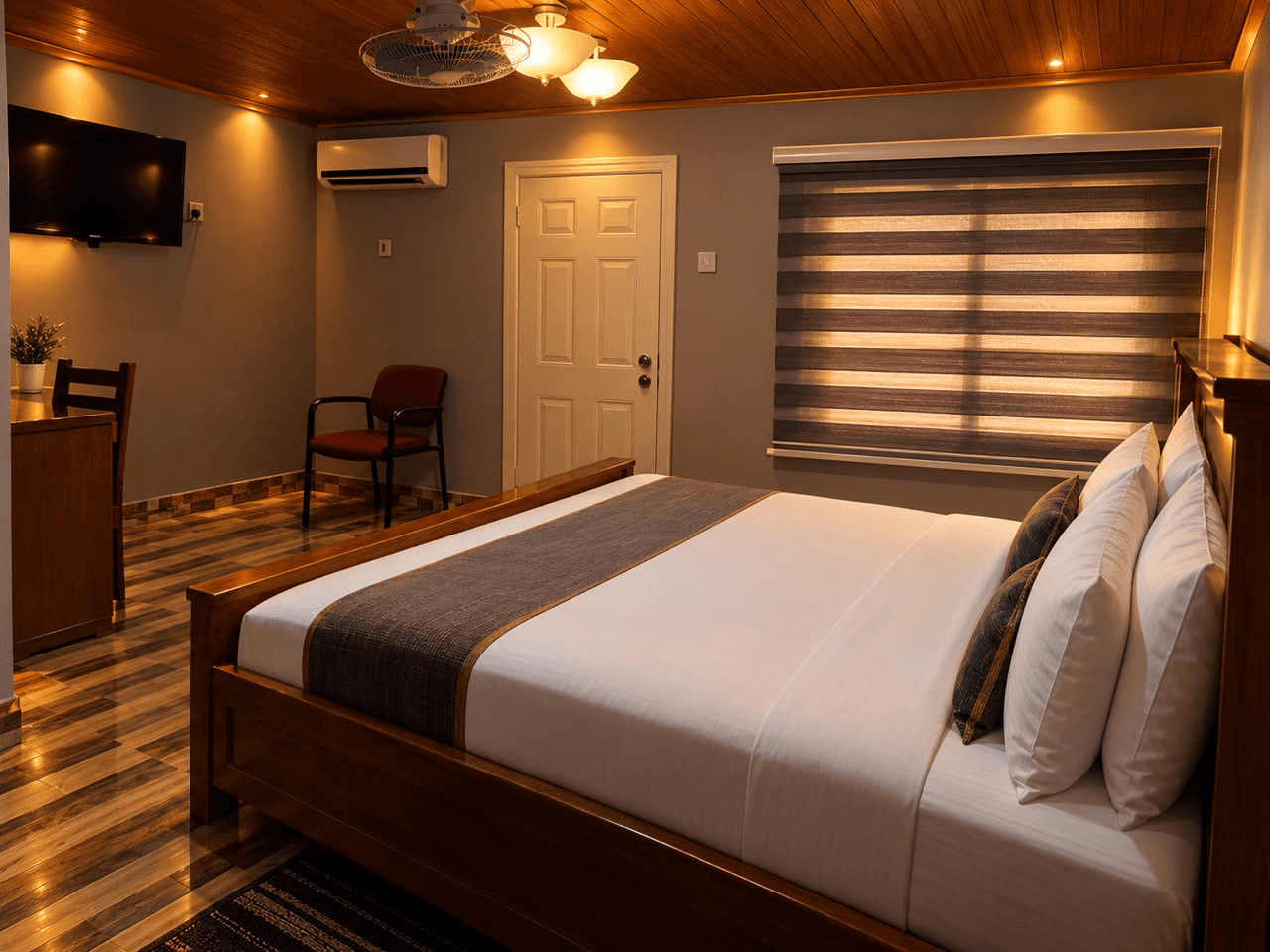 New Jersey double room with a wooden bed, television, air conditioner, and window blinds at JC Guest House