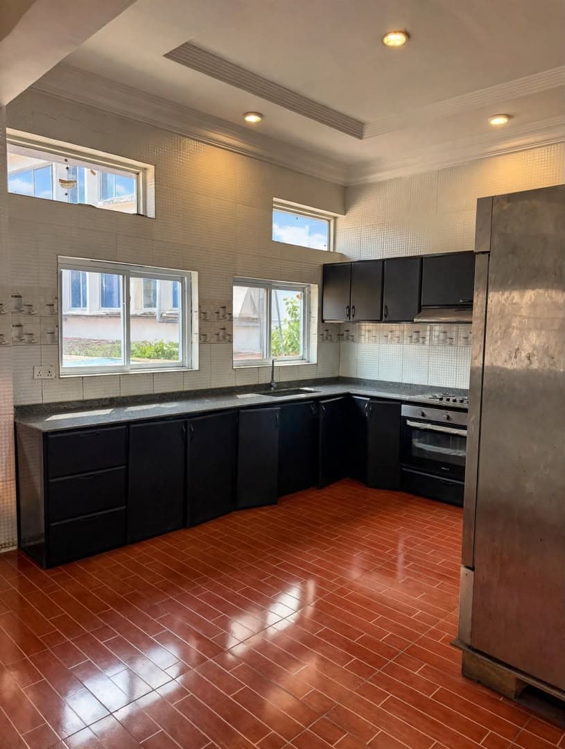 The Banquet Hall catering kitchen with a long worktop, oven and commercial refrigerator